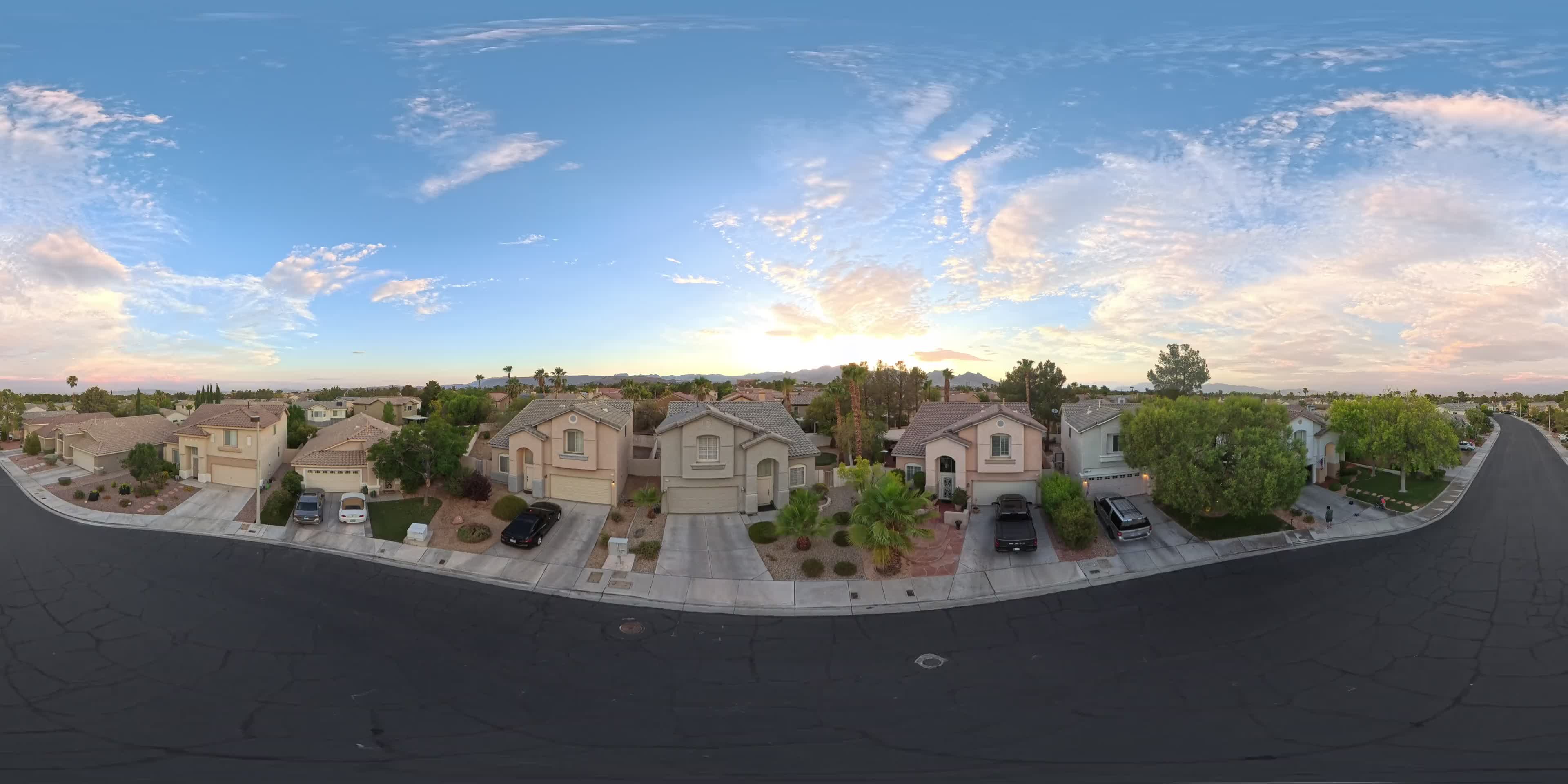 Aerial 360-degree still over the property grounds at sunset
